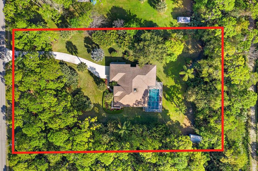 With 2,009 Sq. Ft. under air, this meticulously landscaped 3 bedroom, 2 bathroom pool home in Jupiter Farms is ready to be yours. Enjoy the florida lifestyle on your oversized screened-in patio overlooking a shimmering pool. As you enter this house, you'll be welcomed in by high, vaulted ceilings with a skylight. The split floor plan can easily be renovated to become one great room. The master bedroom has a beautiful tray ceiling and slider out to the pool, bringing in tons of natural light. The master bathroom has dual sinks, a separate spa tub and stand alone shower. Both additional bedrooms are on their own wing of the house with a separate entrance to the pool. Pool resurfaced in 2017, 2005 roof and sunroof, 2019 Kitchen appliances, A/C only 5 years old.