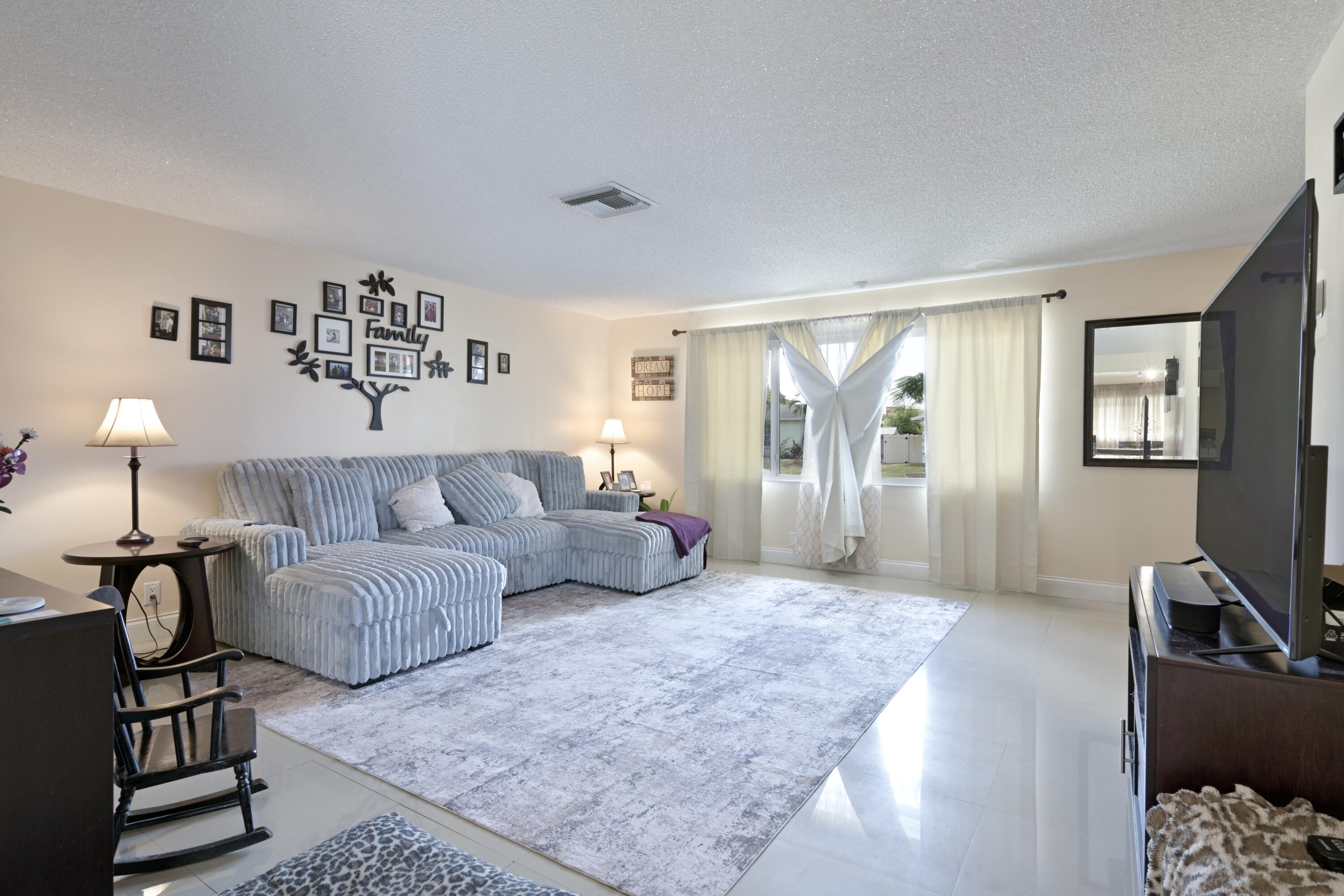 Welcome to your new home, a generous 4 bed, 3 bath home situated in the Village of Palm Springs with NO HOA! This property features hurricane impact windows and doors, including the garage door, ensuring enhanced security, peace of mind and reduced insurance costs! Recent improvements comprise a newer AC (2022), a newly installed fence around the property (2023), updates to 2 out of 3 showers in baths, comprehensive electrical work completed throughout the home (2019), a brand new refrigerator purchase just months ago, and a roof that is only 9 years old!! Come and relish in the expansive yard this home has to offer! Tons of room for a pool, toys and pets to roam around! Great location!! Come check it out today before its gone!