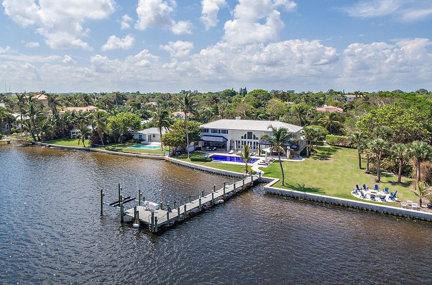 Spectacular Waterfront Estate with deep water dockage. The property boasts 178’ of water frontage, with an acre of land. The main house is comprised of 5 bedrooms, 6.5 baths with a separate 1 bedroom, 1 bath guest house, ideal for nanny or boat captain. This 7,600 square foot home is gated & beautifully landscaped with pool, spa, outdoor kitchen and fire pit to name a few amenities. Terrific value at $5,500,000