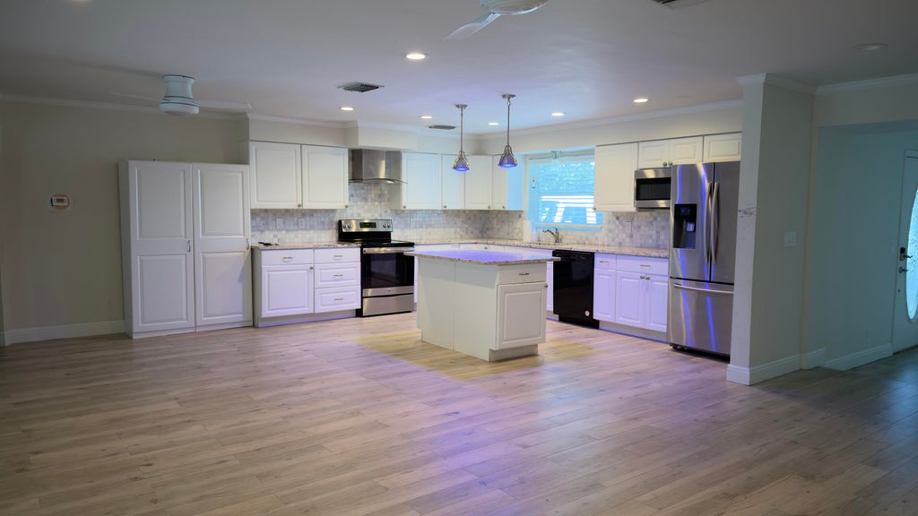 Photo of 4188 LARCH Avenue, Palm Beach Gardens, FL 33418 (MLS # B26063763)