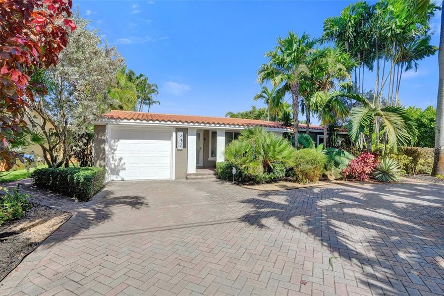 Tucked away in one of Wilton Manors’ most private waterfront lots, this beautiful home offers total tranquility w/ serene canal & mangrove views. Featuring great curb appeal w/ large semi circle driveway, lush mature landscaping & cozy covered front porch. Inside you have large porcelain tile floors, impact windows/doors throughout, bright Florida room, guest room, & home office all w/ direct water views. Outside this home shines w/ multiple seating/entertaining areas, covered lanai, hot tub/spa, 30 foot dock w/ocean access, & heated pool. Recent updates include flat roof (2025), AC System (2024), Tankless WH, Dock, Bumpers, & Ladder (2023), Dryer (2022), Pool Coping, Resurfacing, Lighting, Lanai & Back Patio w/ Travertine Pavers (2021).  Prime location near Wilton Drive.