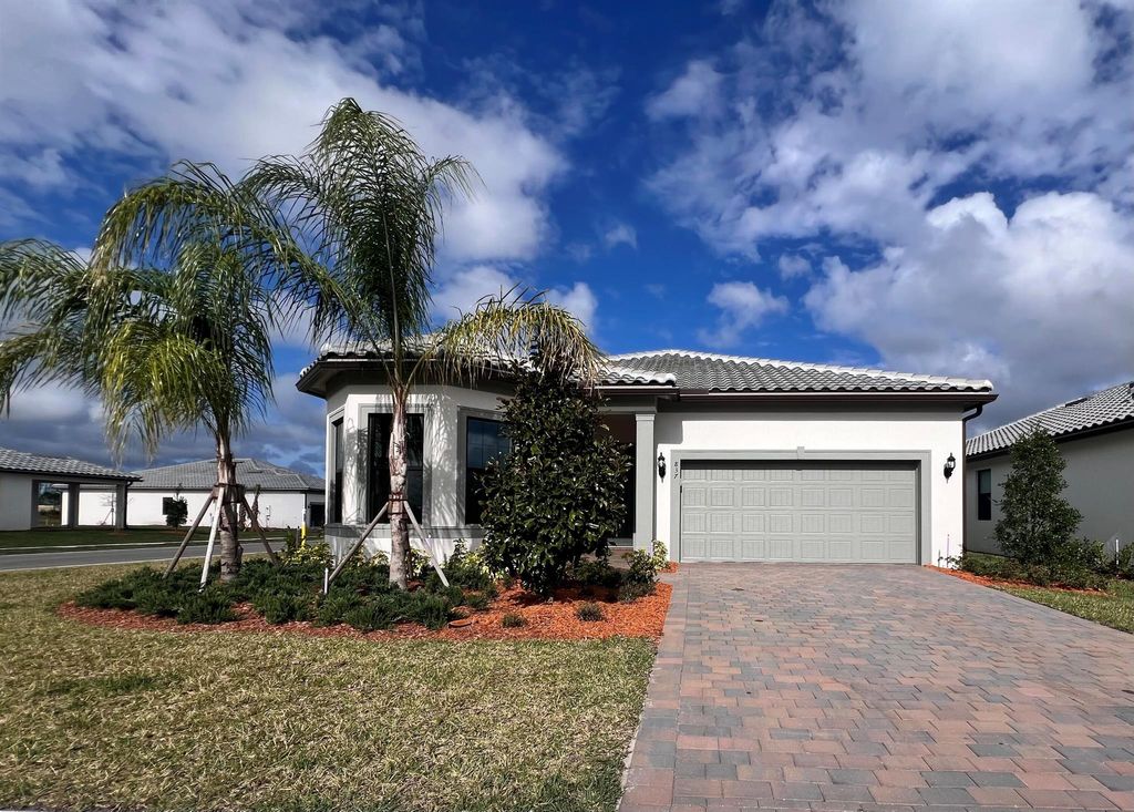 Photo of 837 SE Courances Drive, Port Saint Lucie, FL 34984 (MLS # R10966151)