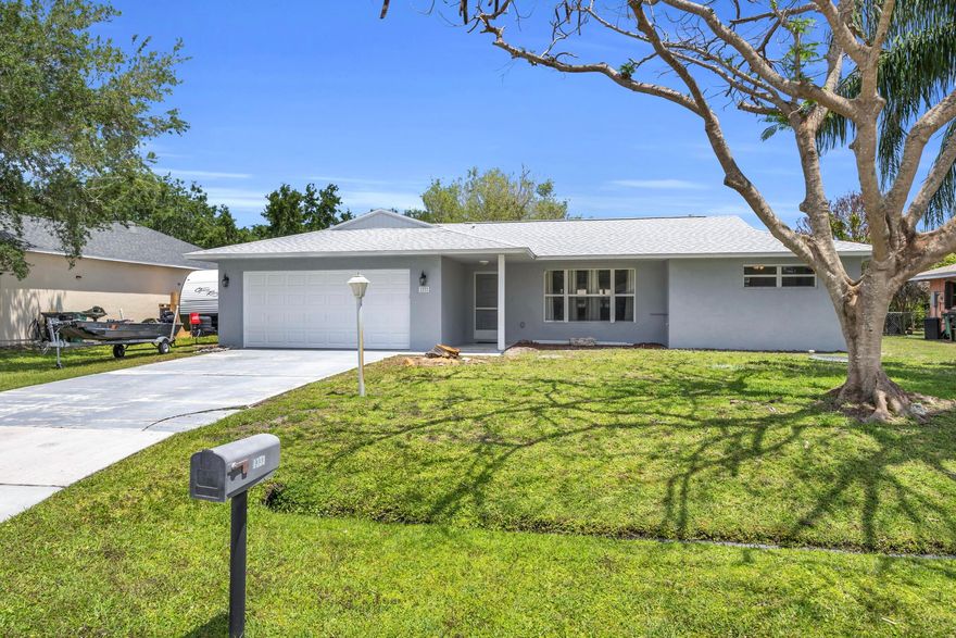 Move-in ready concrete home with a 2023 roof! This beautiful single-family home features a freshly painted interior & exterior, privacy-fenced yard, an expansive 25-ft screened patio perfect for relaxing. Inside, you'll love the open plan with vaulted ceilings, abundant natural light, & pocket sliding glass doors that seamlessly connect indoor & outdoor living. The spacious split-bedroom layout offers a private owner's suite separated from two guest bedrooms. The open kitchen includes a convenient pass-through window to the patio, ideal for hosting with ease. Additional features include hurricane panels & underground power lines for added peace of mind. Located in a quiet, centrally located neighborhood near Crosstown Pkwy, schools and parks.
