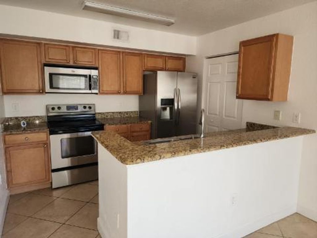 Photo of 131 SW Palm Drive #107, Port Saint Lucie, FL 34986 (MLS # R11000112)