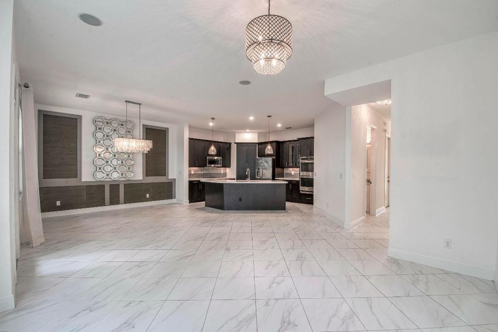 Photo of 1036 Piccadilly Street, Palm Beach Gardens, FL 33418 (MLS # R11063547)