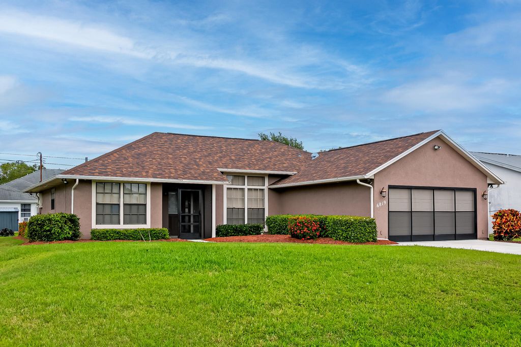 Photo of 6819 NW Dragon Street, Port Saint Lucie, FL 34983 (MLS # R10972610)