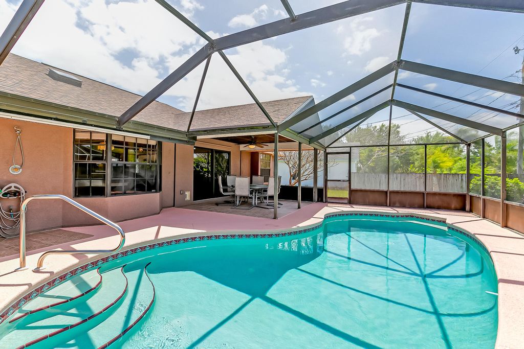 Photo of 6819 NW Dragon Street, Port Saint Lucie, FL 34983 (MLS # R10972610)