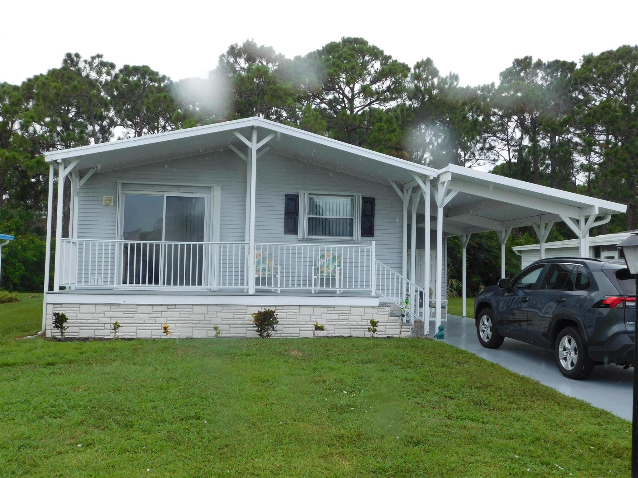 price reduced! Land Owned home. Built in 2006!! Immaculate 2 bedroom/2bath on the preserve. A/C replaced in 2021. Open floor plan. All bright white kitchen appliances. Queen size guest bedroom. Good sized master bedroom with attached bath, large closet. Tile floors in kitchen and both bathrooms. Home is being sold FURNISHED, turnkey. Awesome front porch. New electrical box in 2022. Storage shed at end of carport. Home is tenant occupied.