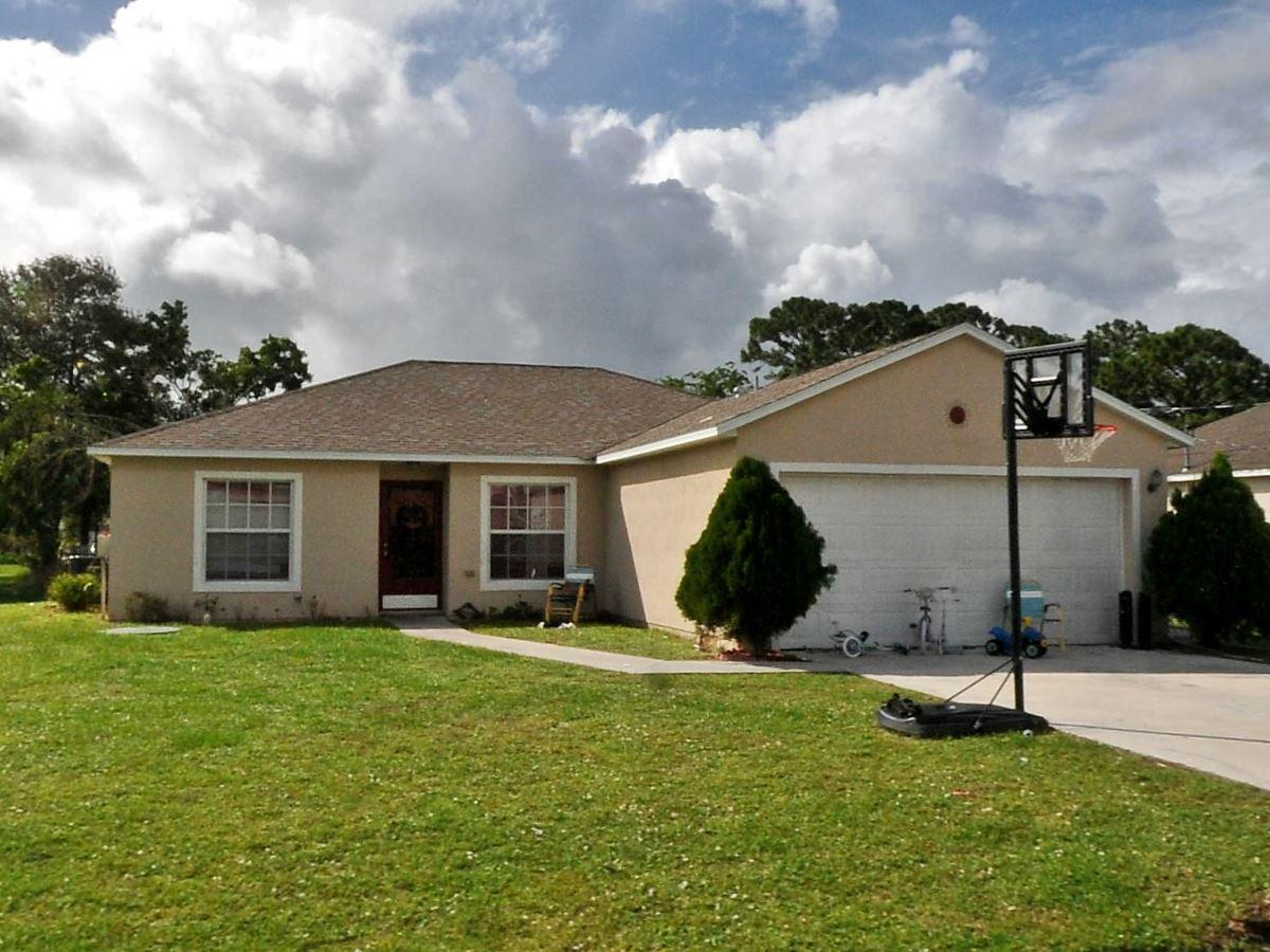 reat opportunity to grab a 4 bedroom home for below market value. Home was just recently painted and fixed. Kitchen was updated with new paint and newer appliances. HOME DOES NOT HAVE A GARAGE, OWNER IS STORING PERSONAL BELONGINGS IN THERE. OWNER HAS MADE SHED AVAILABLE. DRIVEWAY PARKING AND SIDE OF HOME. Home has no carpet for easy cleaning, home is close to port st lucie blvd.