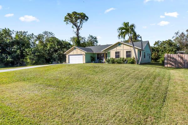 Nestled in the sought after community of Indian River Estates, this spacious home offers a well-planned split floor layout perfect for accommodating a growing family. The over sized kitchen includes a handy pass through to the large screened lanai, making it ideal for entertaining. The master suite is generously sized and offers comfort and privacy, while the home features tile flooring throughout for easy maintenance. A two-car garage provides ample room for both parking and extra storage. Just minutes from the beach and downtown, the location can't be beat. Come see it for yourself!