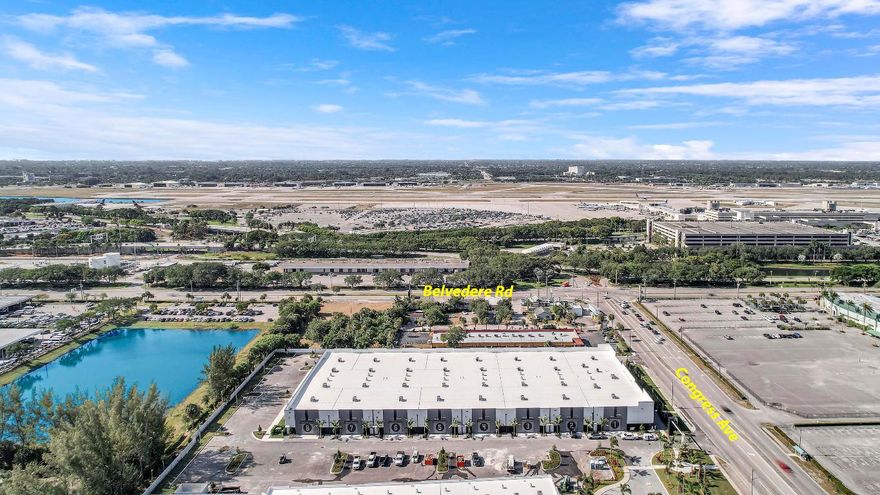 Situated adjacent to The Hangar, virtually in sight and walking distance of the 
PBI Airport, Airfield Park offers the perfect solution for enthusiasts seeking secure storage for their valuable assets including; wine, art, and automobile collections. Totalling 81,992 sqft w/ 16 Units ranging from 5,011 to 5,884 square feet standard with a private ADA compliant restroom. Solid concrete tilt wall construction with 14' x 14' Miami Dade Hurricane Rated insulated garage and pedestrian doors. Latest AI technology security with live monitoring. Featuring a state-of-the-art conference center, complete with a boardroom and expansive event space.   Select businesses are allowed to operate within Airfield Park with prior Association approval. Private tours available with select and qualified buyers