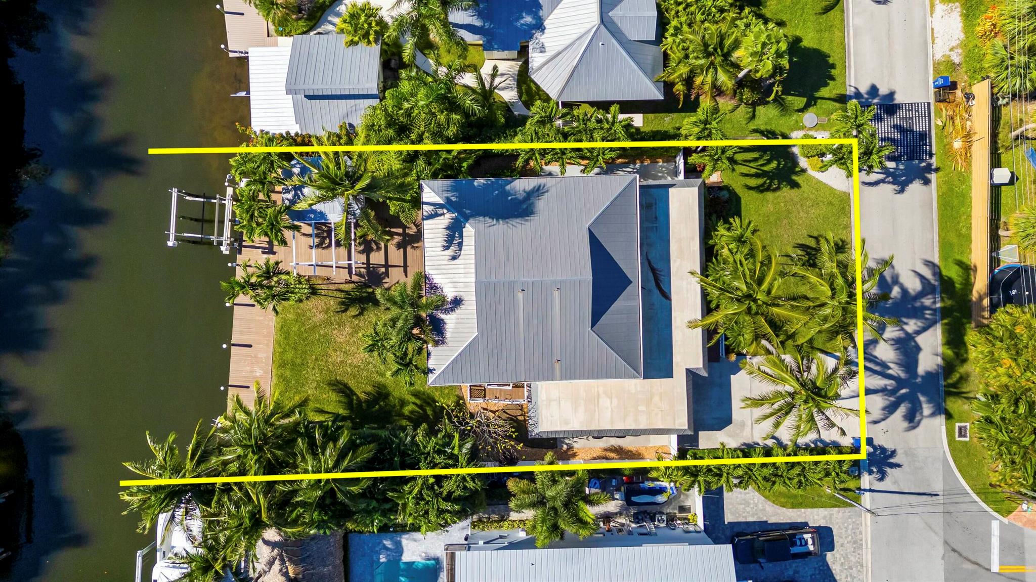 Stunning Key West-Style Waterfront Home in Jupiter, FL - A Boater's Dream! This beautifully remodeled 5-bedroom, 3 1/2-bath waterfront home, located in the heart of Jupiter, Florida, offers the ultimate in coastal living. Set on 78 feet of prime waterfront property on , a deep water canal the home features a dock with electric and water, plus a 13,500 lb boat lift - perfect for boating enthusiasts. With no fixed bridges, you'll have quick and easy access to the Intracoastal Waterway and just minutes from the Jupiter Inlet to the Atlantic Ocean. Original house was gutted to exterior walls and rebuilt with a second story in 1995 under Dade County Codes, then completely remodeled/updated in 2022 inside. The home blends modern luxury with classic Key West charm. Inside, you'll find