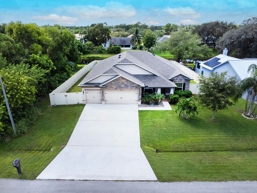 Modern Traditional 4BR/3BA Home | 3 Car Garage | Hot Tub Spa | Fully Fenced Yard | Boat/RV Parking | Sandhill Crossing  This beautifully upgraded modern traditional home offers 4 bedrooms, 3 bathrooms, a 3 car garage, and a long list of premium features.  Come see where you could be living!  -  This beautifully upgraded modern traditional 4-bedroom, 3-bathroom Maronda Sierra Plan offers timeless design, modern comfort, and great  all around features. Built just 7 years ago, this home includes a spacious 3 car garage and an impressive real stone façade, creating strong curb appeal from the moment you arrive.  -  Inside, enjoy a chef's kitchen complete with a double oven, sleek glass cooktop, granite countertops, and ceramic tile throughout the main living areas. The luxurious primary suite features an oversized walk in shower with a relaxing rain showerhead. An ensuite guest bedroom with an upgraded walk in shower provides comfort and privacy for visitors. Additional interior highlights include a large laundry room with cabinets and counter for folding, white wood look blinds, and a state of the art security system with Wi Fi-enabled smart home features.  -  Outdoor living is exceptional. Relax on your patio, which is fully electric privacy screened, perfect for enjoying the comfortable hot tub spa. The freshly sodded, fully fenced backyard includes a double gate with removable post, offering ample space for boat or RV parking in the separate fenced side yard. The exterior also features wrap around bronze gutters, building color matched downspouts, and a bronze framed electric roll up screen for added style. The 3 car garage includes a utility sink for added convenience.  -  Nestled in Sandhill Crossing, this home sits in a tranquil setting beside the Savannah Preserve and state park. You're just a few miles from the intracoastal—be sure to view the aerial photos to appreciate this quiet, serene pocket of Port Saint Lucie. The home is also located just one street away from the Green River Parkway Trail, offering a beautiful 4 mile walking path along the preserve.  -  Enjoy quick access to everything the Treasure Coast has to offer: shopping at the Treasure Coast Mall, dining and entertainment in downtown Jensen Beach and downtown Stuart, beaches, boat launches, and major roadways—all within a 10-20 minute drive. No HOA, providing ultimate flexibility.  -  Don't miss out on this exceptional home in East Port Saint Lucie's the most peaceful and desirable area.  -  THE BEST OF PSL IS TRULY EAST OF US1!