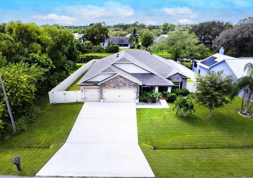 Modern Traditional 4BR/3BA Home + Flex Room| 3 Car Garage | Hot Tub Spa | Fully Fenced Yard | Boat/RV Parking | Sandhill Crossing  This beautifully upgraded modern traditional home offers 4 bedrooms, 3 bathrooms, a 3 car garage, and a long list of premium features.  Come see where you could be living!  -  This beautifully upgraded modern traditional 4-bedroom, 3-bathroom w/ Flex room Maronda Sierra Plan offers timeless design, modern comfort, and great  all around features. Built just 7 years ago, this home includes a spacious 3 car garage and an impressive real stone façade, creating strong curb appeal from the moment you arrive.  -  Inside, enjoy a chef's kitchen complete with a double oven, sleek glass cooktop, granite countertops, and ceramic tile throughout the main living areas. The luxurious primary suite features an oversized walk in shower with a relaxing rain showerhead. An ensuite guest bedroom with an upgraded walk in shower provides comfort and privacy for visitors. Additional interior highlights include a large laundry room with cabinets and counter for folding, white wood look blinds, and a state of the art security system with Wi Fi-enabled smart home features.  -  Outdoor living is exceptional. Relax on your patio, which is fully electric privacy screened, perfect for enjoying the comfortable hot tub spa. The freshly sodded, fully fenced backyard includes a double gate with removable post, offering ample space for boat or RV parking in the separate fenced side yard. The exterior also features wrap around bronze gutters, building color matched downspouts, and a bronze framed electric roll up screen for added style. The 3 car garage includes a utility sink for added convenience.  -  Nestled in Sandhill Crossing, this home sits in a tranquil setting beside the Savannah Preserve and state park. You're just a few miles from the intracoastal—be sure to view the aerial photos to appreciate this quiet, serene pocket of Port Saint Lucie. The home is also located just one street away from the Green River Parkway Trail, offering a beautiful 4 mile walking path along the preserve.  -  Enjoy quick access to everything the Treasure Coast has to offer: shopping at the Treasure Coast Mall, dining and entertainment in downtown Jensen Beach and downtown Stuart, beaches, boat launches, and major roadways—all within a 10-20 minute drive. No HOA, providing ultimate flexibility.  -  Don't miss out on this exceptional home in East Port Saint Lucie's the most peaceful and desirable area.  -  THE BEST OF PSL IS TRULY EAST OF US1!