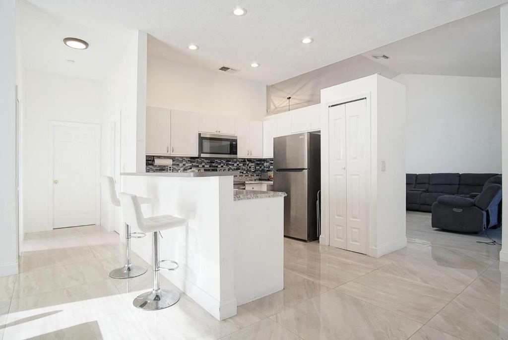 Photo of 2619 SW Fair Isle Road, Port Saint Lucie, FL 34987 (MLS # R11155960)