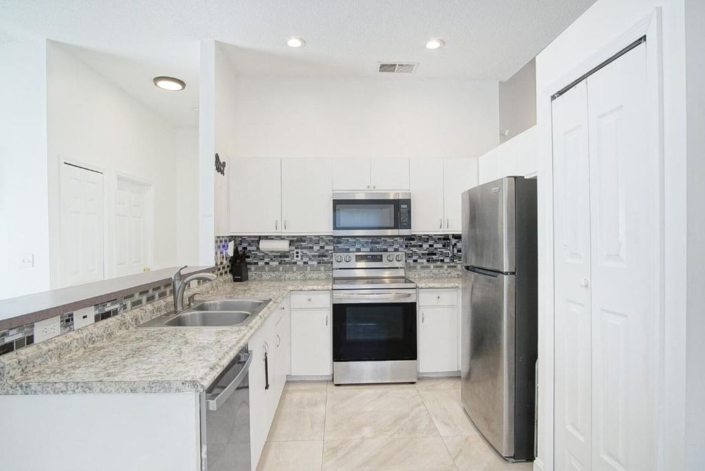 Photo of 2619 SW Fair Isle Road, Port Saint Lucie, FL 34987 (MLS # R11155960)