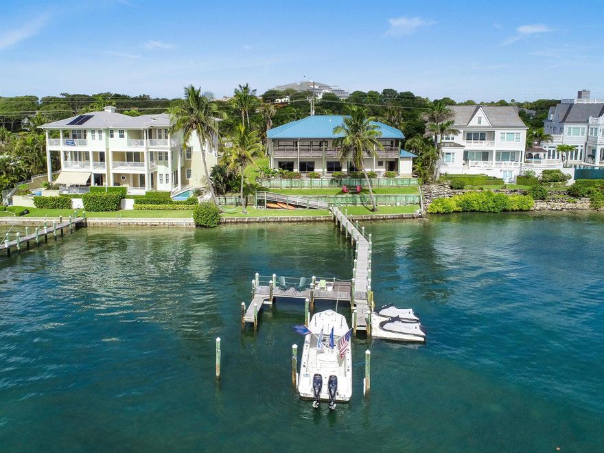 Rare opportunity to buy this Direct Intercoastal property that offers the best beautiful turquoise waters as your backyard. Over 100 feet of direct ocean access water frontage and panoramic views of the exclusive Jupiter Island. Build your dream home or remodel the existing house. The dock has multiple slips and can accommodate up to an 80' yacht in this no-wake zone. This property is zoned for residential or commercial use and boasts tremendous opportunities. Currently divided into several units. Just minutes from Jupiter & Tequesta with Martin County taxes. Surrounded by impressive new construction homes. Unlimited possibilities! This one won't last long!