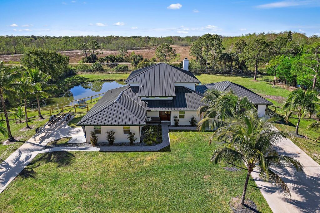 Photo of 8718 150th Court N, Palm Beach Gardens, FL 33418 (MLS # R11081232)