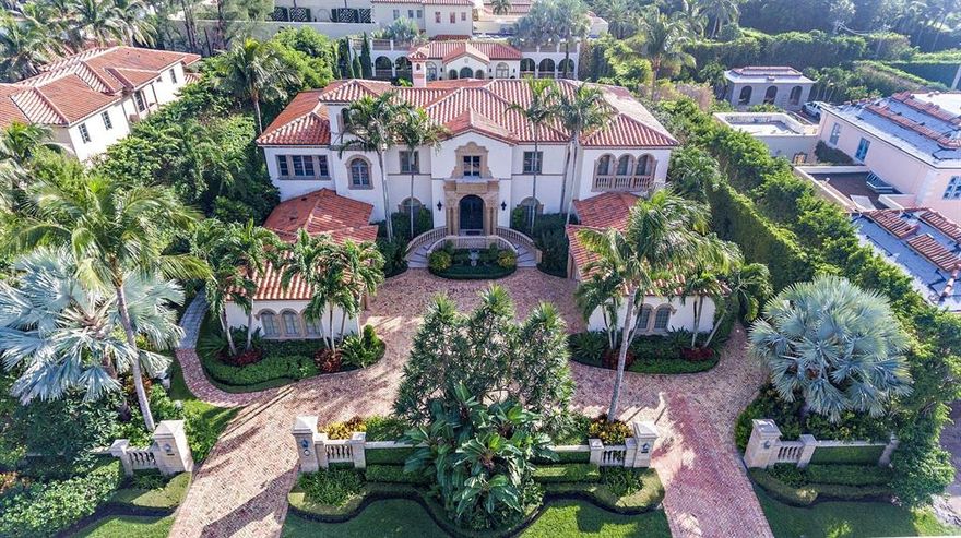 120 Clarendon is an elegant Mediterranean treasure situated on 3/4 of an acre in the estate section on Palm Beach Island. This 12,773 SF home features eight bedrooms, nine bathrooms, and two powder rooms.  The grand entrance is graced by a twin spiral staircases that leads to the second floor. The master bedroom occupies most of the home's second floor. This expansive suite is outfitted with timeless decor and finishes as well as dual bathrooms, large closets, and a sprawling balcony that provides breathtaking views of the gardens and pool below. This magnificent homes also features a first floor grand suite, ample staff quarters, an elevator, and 4 car garage.