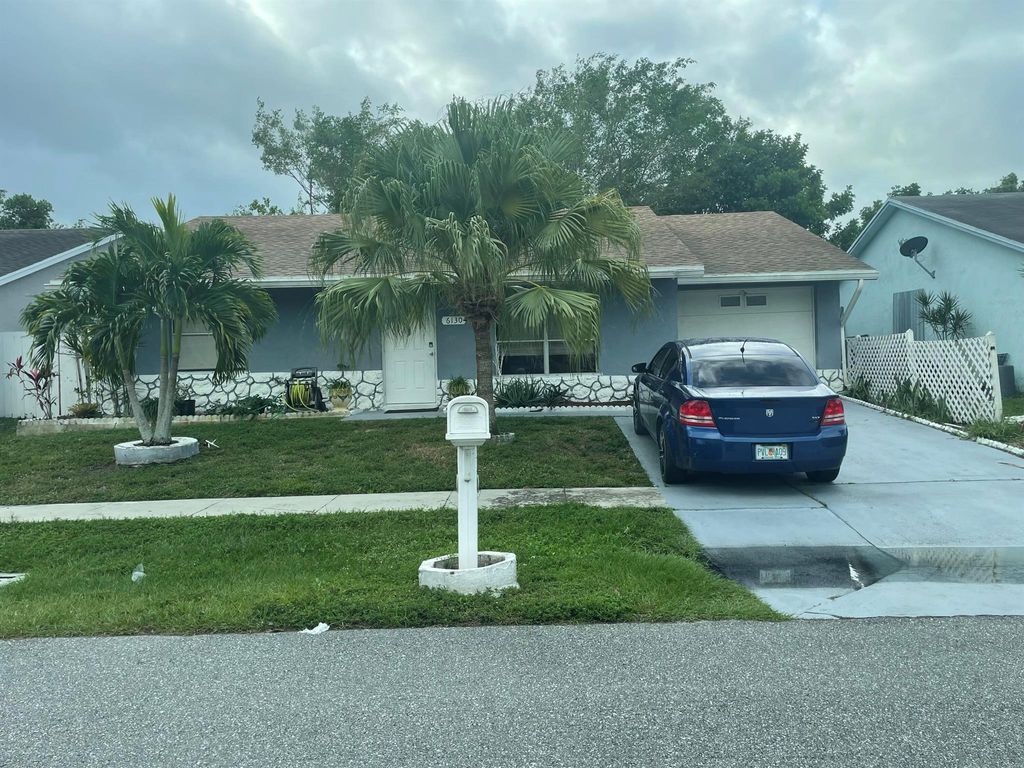 Photo of 6130 Bluegrass Circle, Greenacres, FL 33463 (MLS # R11147905)