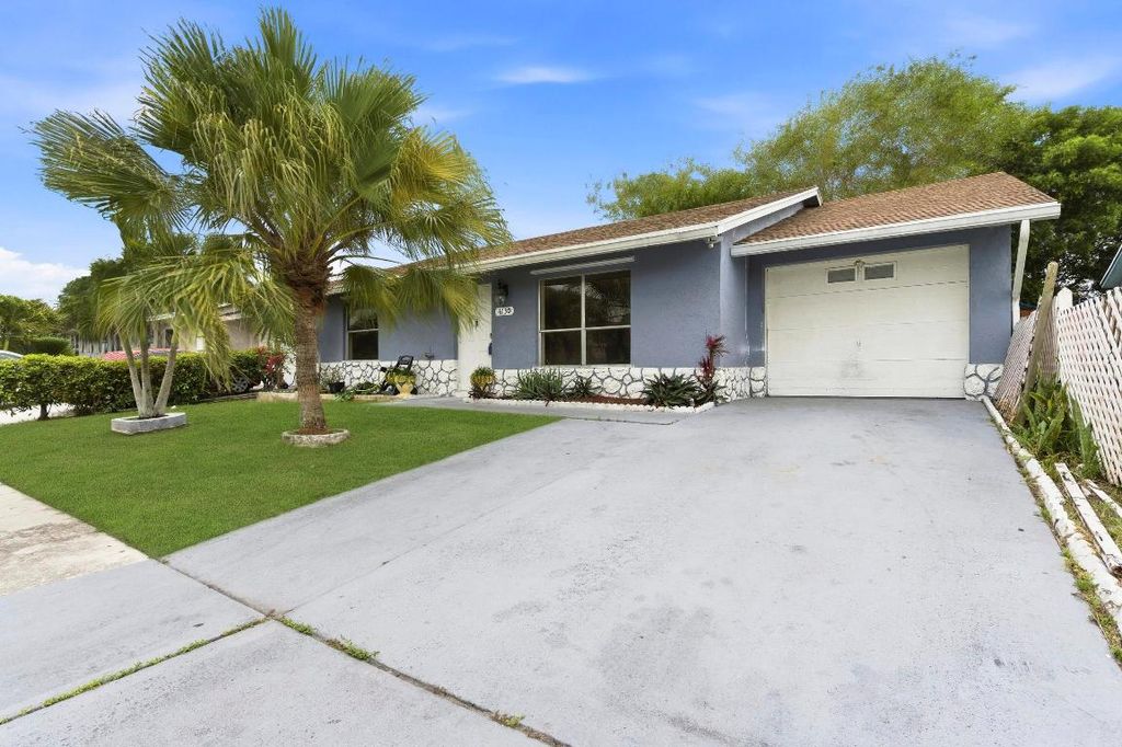 Photo of 6130 Bluegrass Circle, Greenacres, FL 33463 (MLS # R11147905)