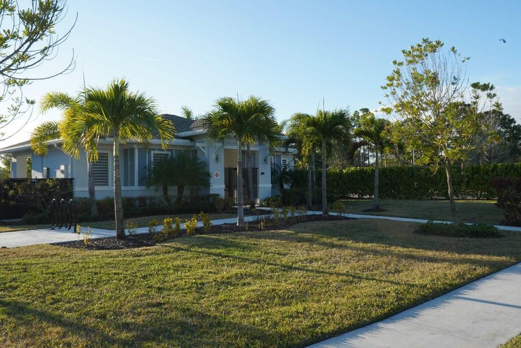 Photo of 870 SE Grovebush Lane, Port Saint Lucie, FL 34984 (MLS # R11153871)