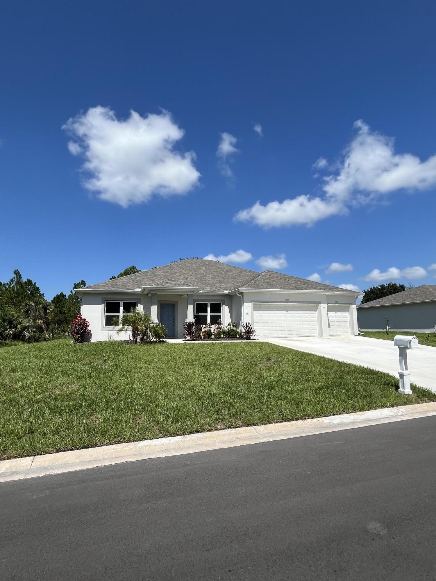 Your dream home awaits! Discover this recently built 2,487 sq ft residence situated on a premium 0.33-acre corner lot valued at nearly $100,000. Perfect for an expanding family, this stunning home features a split floor plan with 3 bedrooms, a bonus room adaptable for 4th bedroom, gym or office. 3 full bathrooms , a separate dining room, and a 3-car garage. Enjoy the tranquility of the expansive screened lanai overlooking a spacious backyard ideal for a pool, playground, or RV storage. This property boasts no HOA fees and includes county water and sewer services. Highlights include over $45,000 in upgrades such as tile flooring, a screened lanai, epoxy garage floor, and more. Schedule a tour today of your new home, conveniently located less than 7 miles from beaches and shopping.