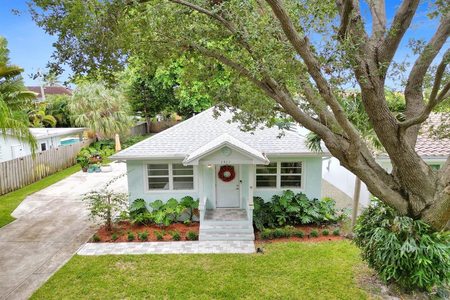 Welcome to downtown Lake Worth Beach in the South Palm Park neighborhood! This beautifully renovated cottage is a 2-bedroom, 2-bath home and is located in the highly desirable Historic District of Lake Worth Beach. The home is just one block from the intracoastal, 1.5 miles to Bryant Park and Lake Worth Beach. Every detail has been upgraded, including a new roof, hurricane impact windows, open modern kitchen, updated bathrooms, new laminate flooring throughout, LG appliances w/ double oven, crown molding, and a coffered ceiling. The exterior shines with fresh stucco, paint, irrigation, and landscaping. Enjoy the spacious backyard from the covered porch, featuring a 10x12 air-conditioned CBS utility/workroom and plenty of space for a pool. Come check out what Lake Worth Beach is all about