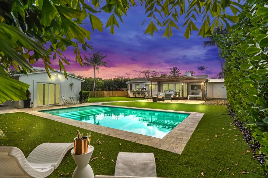 Situated on an oversized, corner lot, this fully remodeled home features the latest design trends and high-end finishes, boasting a massive outdoor space with separate GUEST HOUSE overlooking a luxurious salt water pool. The main house's open concept allows a free flow to a panoramic view of the pool, offering natural light throughout. The kitchen features oversized quartz counters with an inviting breakfast bar, custom built cabinetry and backsplashes. The tastefully done primary bath features a walk-in shower with freestanding tub, which compliments the homes overall aesthetic. From the pergola covered lounge space to the custom built outdoor kitchen, the backyard has been thoughtfully crafted for entertainment. The high quality turfed backyard is an added bonus. TIME TO ENTERTAIN!