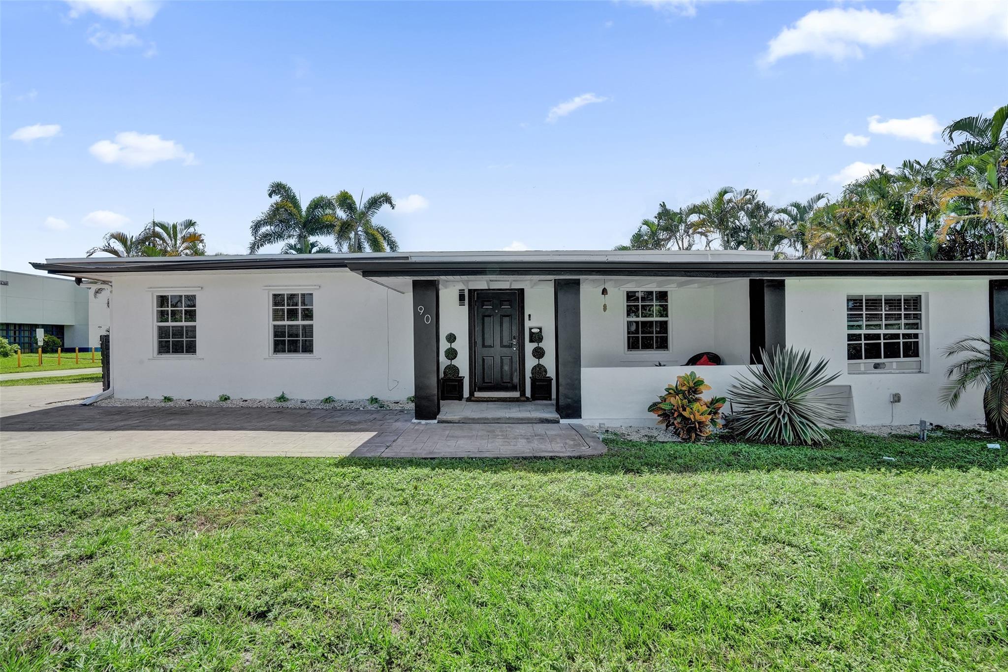 Live the Wilton Manors lifestyle in this bright, airy 2BR + den/3rd BR home on a desirable corner lot just 0.6 miles from Wilton Drive’s vibrant dining, shops & nightlife. Enjoy morning coffee on the spacious covered front porch or relax in the private, fenced backyard with firepit that has been styled so cute—perfect for entertaining. Inside, large windows fill the home with natural light & the open layout is great for socializing. Split bedroom floorplan. Nestled near many parks and everything Wilton has to offer, this charming home blends comfort, style & location! NEW roof as of 6/25. There is a large fenced storage area to the East side of the home. Large circular driveway for easy access on both sides of the lot. Make this home yours or purchase as a rental investment.