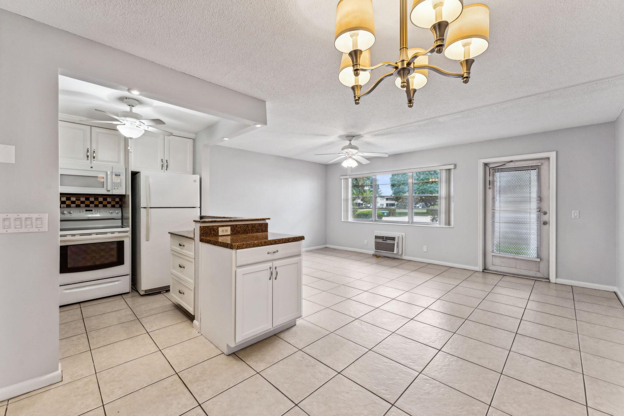 Find your tranquil escape in this beautifully updated 1-bedroom, 1.5-bath first-floor condo! Located in the quietest part of the community, it boasts a modern kitchen with newer appliances, stylish tile flooring, and a lovely enclosed patio. Just nearby, you'll find a community pool, top-tier fitness amenities including a resistance pool, and a lively civic center featuring a 1200-seat theater, a woodshop, a ballroom, and more.