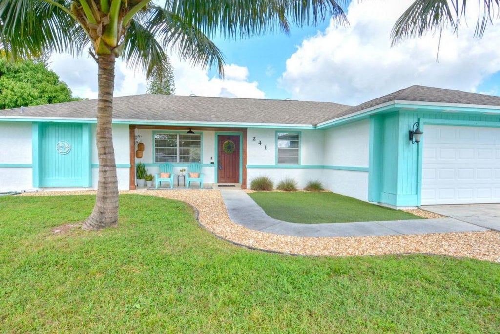 Photo of 241 SW Duval Avenue, Port Saint Lucie, FL 34983 (MLS # R10935083)