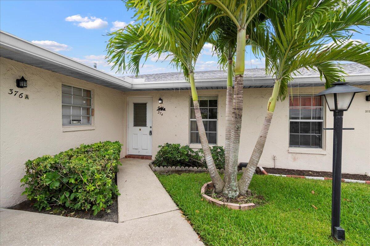 Discover this absolutely spectacular 2-bedroom, 2-bath unit at 374 Bennington Lane in Covered Bridge, a highly desirable and pet-friendly 55+ community in Lake Worth, Florida.Step inside and find a beautifully updated home featuring tiled floors throughout and a kitchen boasting granite countertops and updated appliances. Both bathrooms have been renovated, offering modern comfort and style.One of the true gems of this unit is the enclosed Florida room, which seamlessly extends to a private outdoor patio. It's truly like having your own backyard, complete with several tropical fruit trees! Imagine enjoying your morning coffee or entertaining friends in this serene setting.