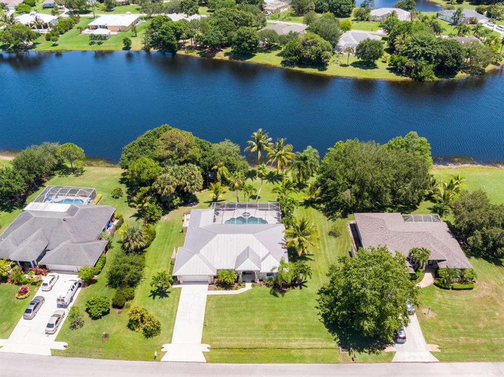 3D TOUR IS AVAILABLE. First time on the market! Enjoy the Florida lifestyle from this CBS 3BR/2.5BA lakefront home on a spacious .56 acre. Imagine entertaining or relaxing poolside, overlooking the lake while soaking up the fresh air, listening to the sounds of nature beneath the screened lanai accented with a cedar ceiling. The split bedroom floor-plan is complete with a galley kitchen, stainless steel appliances, snack bar & breakfast nook area. Located in one of Martin County's best kept secrets, South Fork Estates. The community consists of 115 home sites and 2 lakes, surrounded by multiple preservation areas backing up to the Atlantic Ridge Preserve.Close proximity to I-95, US-1, schools, shopping, dining, medical services & parks. https://my.matterport.com/show/?m=Rz3nvBpJdbq&brand