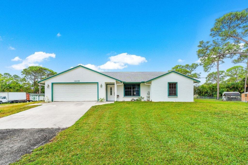 Photo of 12458 78th Place N, West Palm Beach, FL 33412 (MLS # R10957390)