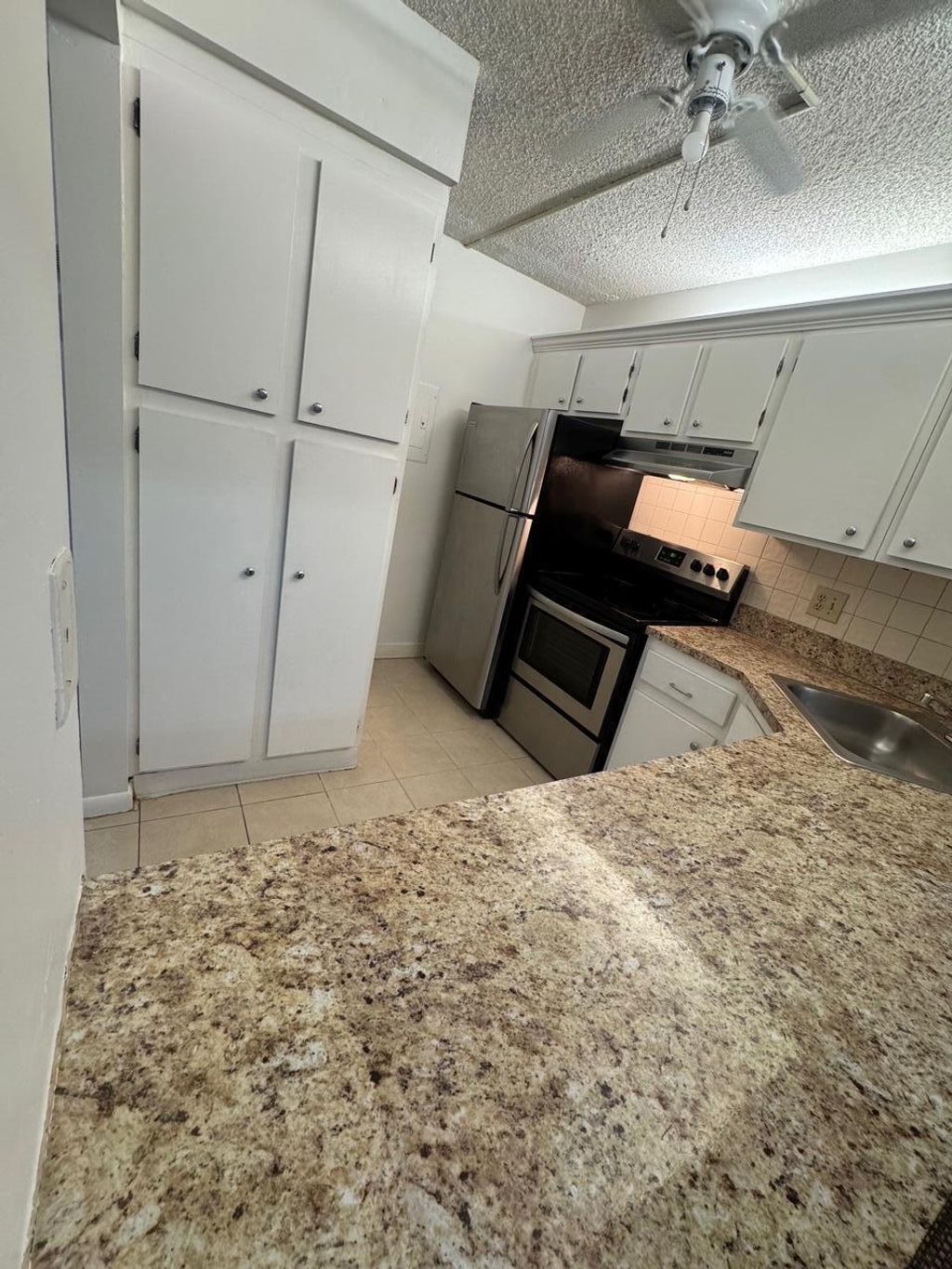 Photo of 703 Sunny Pine Way #C1, Greenacres, FL 33415 (MLS # B26020518)