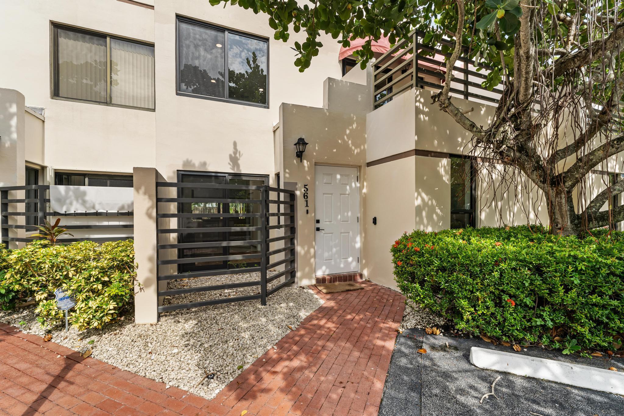 Beautifully remodeled 3-bedroom, 3-bath townhome located directly across from the beach and steps from Palmetto Park Rd's shops and restaurants. Features include an open floor plan, one bedroom downstairs, impact windows, new kitchen, wood floors, new AC, and a private fenced backyard with barbecue. Spacious balcony with treetop views. Available furnished or unfurnished. Minimum 6-month lease or annual rental Small, private 4-unit community with low-maintenance living.