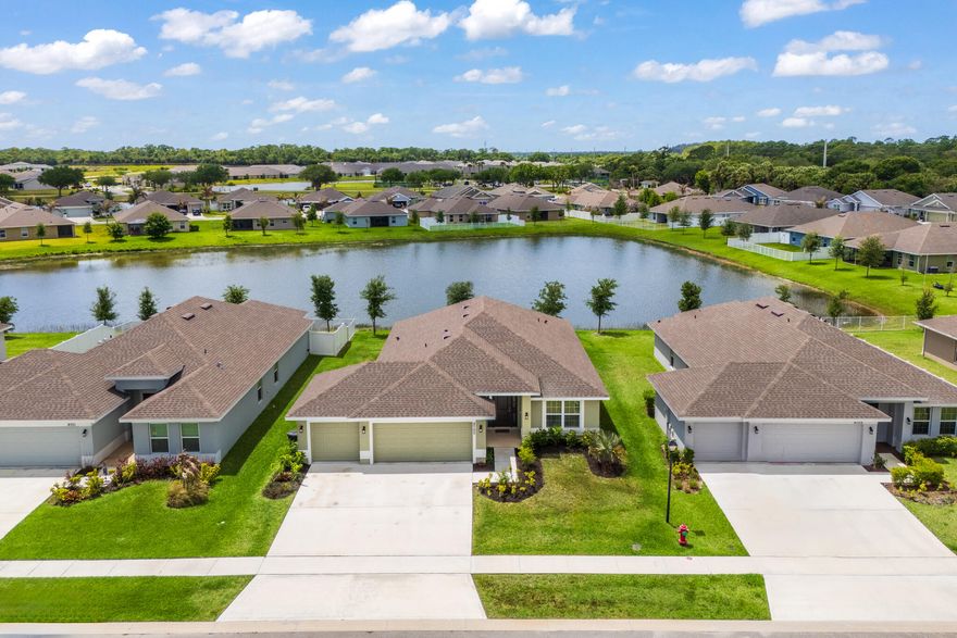 Welcome to this beautiful 2022 built waterfront home featuring an oversized 3 car garage, 4 bedrooms, 2 bathrooms. The primary suite serves as a private retreat, complete with a walk-in shower and relaxing garden tub. Step outside to enjoy Florida's outdoor lifestyle on the covered & screened in patio overlooking a water view perfect for gathering or quiet evening. No Flood Insurance | Low HOA Fees| Resort style-clubhouse | Fitness center| Large swimming pool | Tennis & Pickball Courts. Close to schools, shopping, major highways including quick access to I95. Enjoy being just minutes from downtown, dining, golf course, beaches & the Vero Beach Outlets.