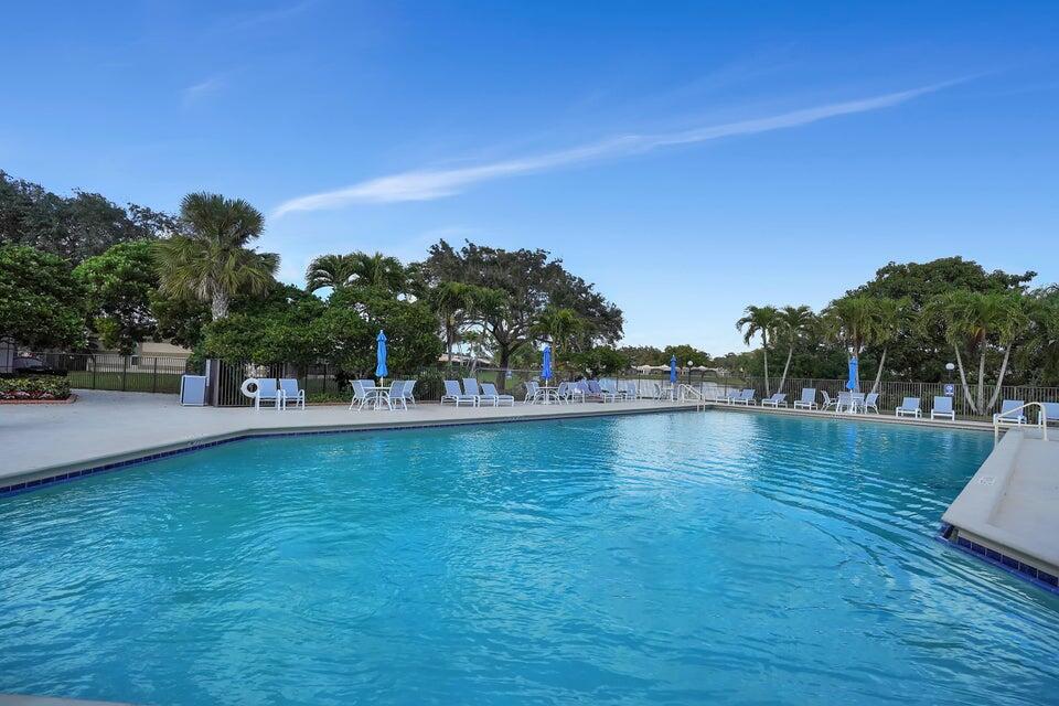 Welcome to your dream home nestled within a vibrant 55 and better community located in central Boca Raton, FL. This community is all about the amenities by offering an active lifestyle with an array of luxurious amenities, including an Olympic-sized pool, hot tub, tennis courts, pickle & bocce ball, clubhouse & more. An active social calendar fosters a sense of belonging and camaraderie among residents. Step inside your home to discover an updated kitchen (new fridg 2025), new AC (2024), fresh paint, new blinds, open floor plan, spacious bedrooms & bathrooms, & a screened-in patio. Admidst the vibrant community buzz, your home serves as a tranquil oasis, offering the perfect balance to active lifestyle. Perfectly located in