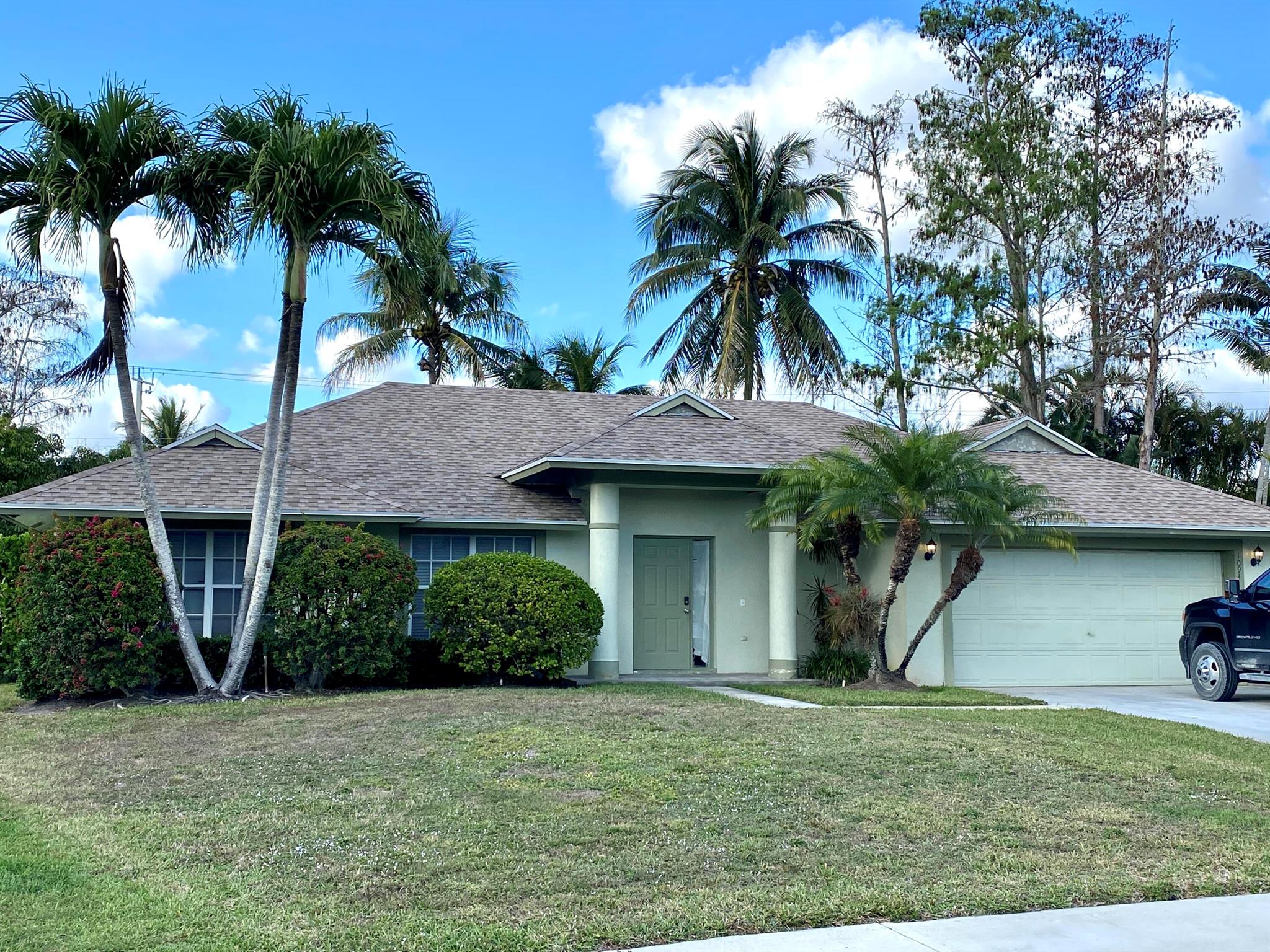 This fully furnished turn-key 1-story 3BR plus Extra air-conditioned Florida Room/2BA house is ready for a fast move-in. Florida Room with queen bed can be used as 4th bedroom. Enjoy open floor plan of the house, eat-in kitchen, separate laundry room, 2 car garage, and a large fenced back yard with your own MANGO trees. No carpet. No HOA. Trucks and Pets friendly. Centrally located in Wellington, with A-rated schools. Just bring your toothbrush! Free MANGOES!