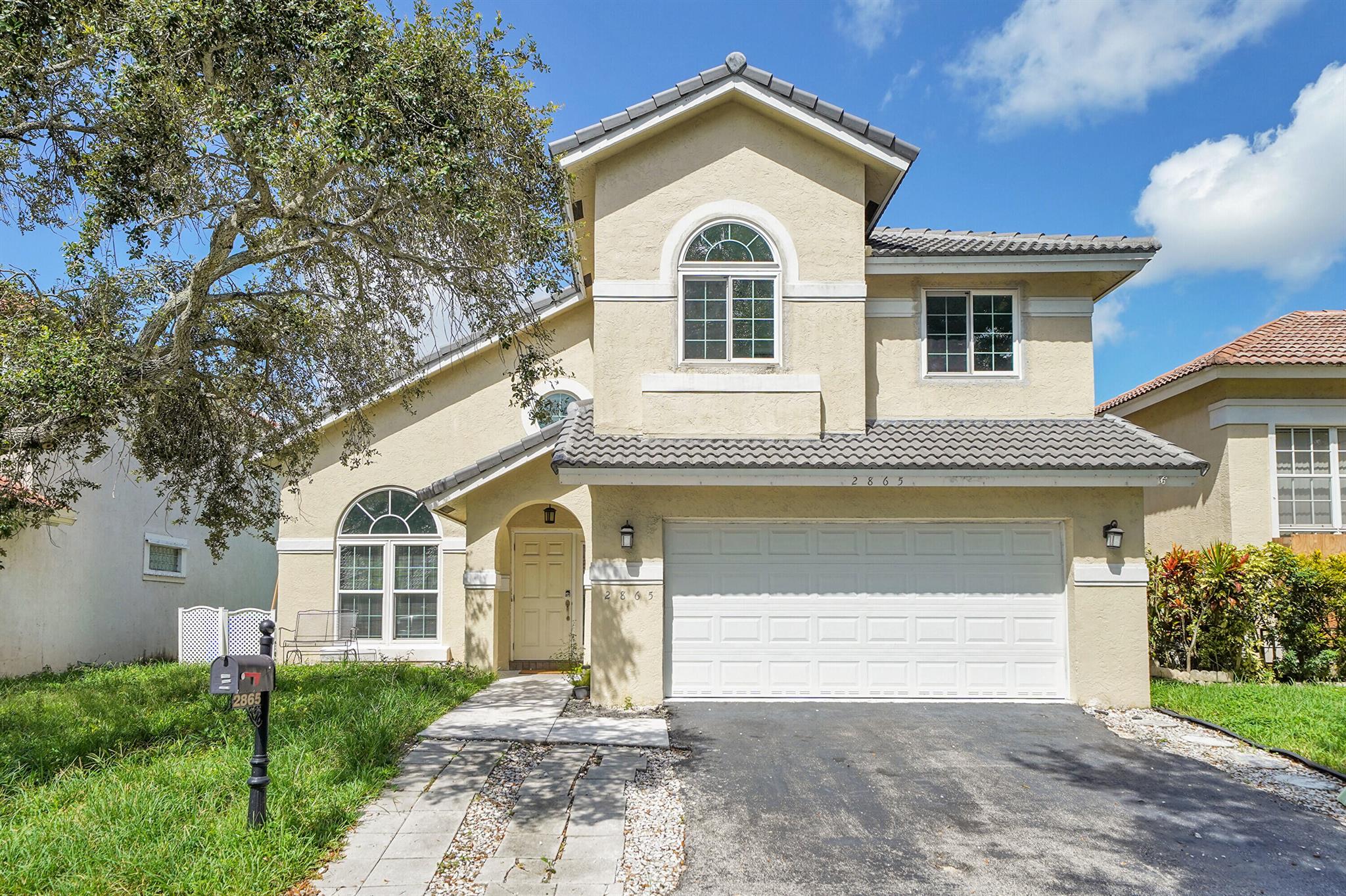 Step inside this spacious and elegant home in the highly sought-after Coral Lakes Estate Community. Featuring vaulted ceilings, 4 bedrooms, 2.5 bathrooms, and a 2-car garage, this property offers the perfect blend of comfort and style for a growing family.Wake up every morning to a breathtaking lake view, enjoy peace of mind with newer roof and impact windows, and experience the warmth of a home designed for both relaxation and entertaining.Perfectly situated near major highways, and endless shopping & dining options. This is more than just a house, it's a lifestyle.