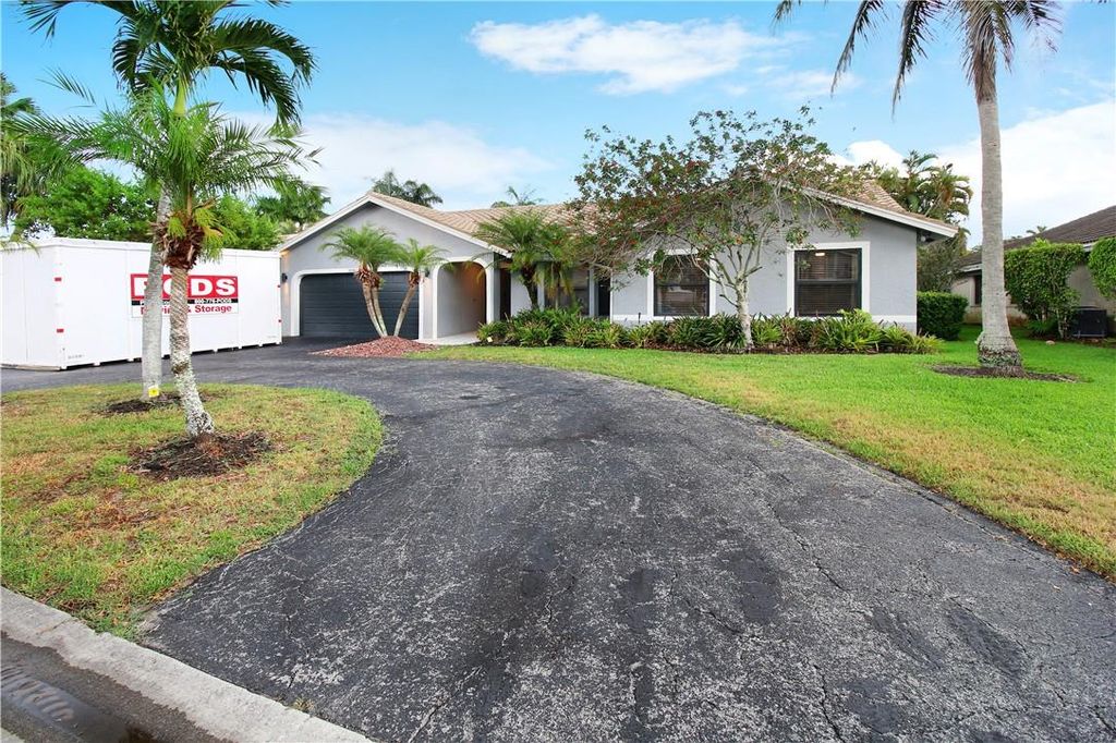 Photo of 5041 NW 64th Drive, Coral Springs, FL 33067 (MLS # F10382960)