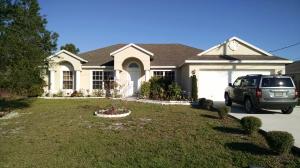 Must see spacious 4/2 with Stainless appliances and Granite countertops. Over 2200 square feet of living space make this house perfect for entertaining or an active family. Only a couple minutes from I-95 for easy access to North or South. Also has a large screened back porch for quiet enjoyment after a long day. Carpets shampooed and fresh paint. Move-in ready