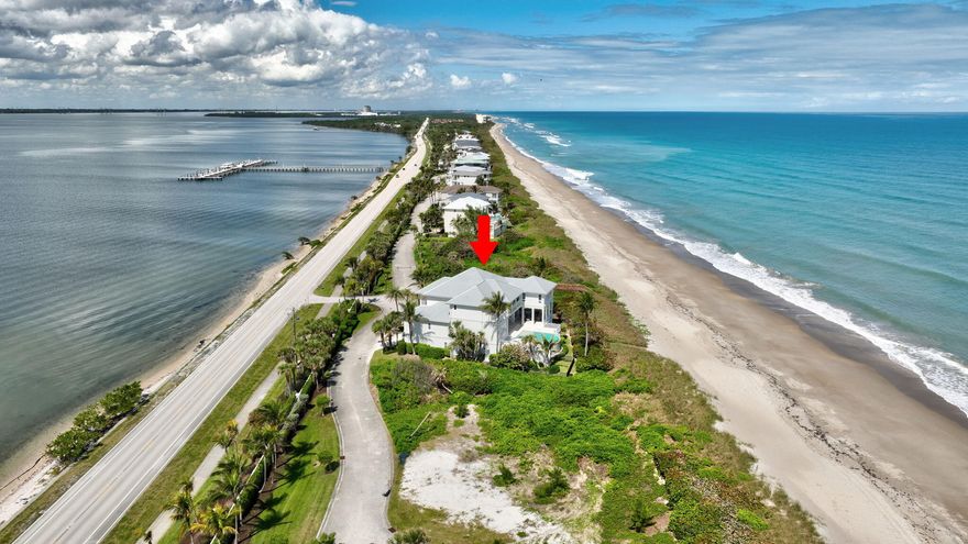 Exceptional custom-built oceanfront estate in a private gated enclave with 100 feet of pristine beach & stunning sunrise/sunset views. Designed for both entertaining and relaxed coastal living, this turnkey, fully furnished home features expansive covered outdoor space with built-in grill, fireplace, resort-style pool and outdoor shower. Boaters can enjoy a 50-foot private dock with easy Intracoastal and ocean access, while sea turtles and dolphins are just steps away. Interior highlights offer a great room opening to outdoor living, pub room with bar, theater seating for 12, professional kitchen with commercial grade appliances, large island with walk-in pantry. Sleeps 16 with five en-suite bedrooms with terraces, bunk room, oversized ocean view primary suite, elevator & 8 car garage.