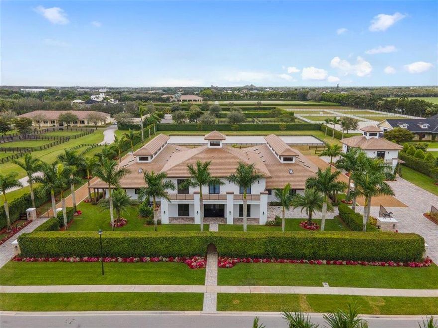 This custom built private farm spared no expense with it's thoughtful design and construction. Situated on 2.5 acres, this property offers 18 stables that are equally divided to reflect one another. Each side equipt with 2 grooming stalls, 2 wash stalls, 2 feed rooms with washer/dryer and 2 lounges with half baths. The outdoor arena is 200x70 with room to expand if needed and surrounding paddocks. The owners quarters feature 3 bedrooms and 3 baths, all en-suite with walk-in closets. There is a state-of-the art kitchen dressed with Thermador Pro collection appliances and parallel to the expansive covered patio. Enjoy outdoor living with a beautiful summer kitchen to include Alfresco BBQ all while overlooking the arena and paddocks. There is a 2 bedroom, 2 bath guest house that rests above a