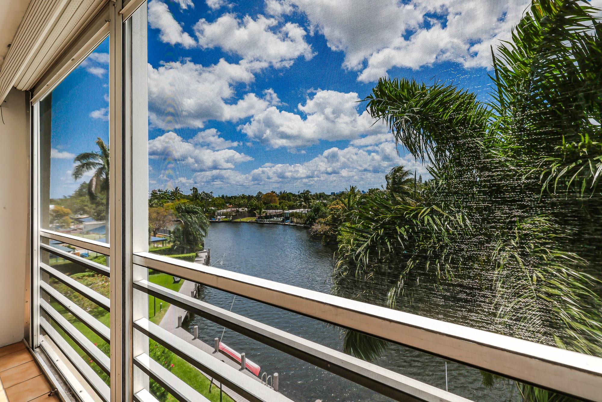 Overlooking the Middle River with views of downtown Ft Lauderdale and the pool is this oversized corner fourth floor condo with windows on three sides offering an abundance of natural light. New ceramic flooring throughout, new baseboards, stainless steel appliances in kitchen (2022), AC (2022), Hot water heater (2022).  Screened in balcony off  of the living room and primary bedroom with sweeping views of the river and slyline provide the perfect  respite for your morning cup of jo.  Convenient location close to the beach, downtown, and Wilton Manors.  The community offers an array of recreational facilities including a waterside pool, tennis courts, ,fitness center and shuffleboard. 40 year certification complete.