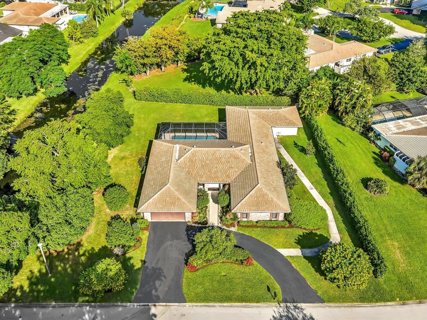 SELLER RELOCATING OUT OF STATE! REMARKABLE MULTIGENERATIONAL ESTATE IS NESTLED WITHIN PRESTIGIOUS TREASURE ISLAND, A DISTINCTIVE ENCLAVE OF MAPLEWOOD WITH ONLY 37 CUSTOM HOMES IN THE HEART OF CORAL SPRINGS WITH NO HOA! THIS ONE OF A KIND METICULOUS  HOME FEATURES A NEW ROOF (MAY 2023) AND FULL IMPACT RATED DOORS & WINDOWS ON HUGE TROPICAL 19,382 SF WATERFRONT LOT! THIS SPACIOUS 3299 SF HOME HAS 4 BEDROOMS 2.5 BATHS (SPLIT PLAN FOR PRIVACY) PLUS A CUSTOM INLAW/GUEST ADDITION BUILT IN 2009 FEATURES A PRIVATE ENTRANCE/SCREENED PATIO BEDROOM, 1.5 BATHS, LIVING ROOM. NEW "WHITISH CLAY" LUXURY FLOORING THROUGHOUT THE HOME PLUS "SMART TECHNOLOGY" SS APPLIANCES, UPGRADED ALARM & MORE. COVERED SCREENED PATIO INCLUDES 2 CABANA BATHS & LARGE HEATED POOL. TOP SCHOOLS, TENNIS, FITNESS TRAILS & TOT LOT.