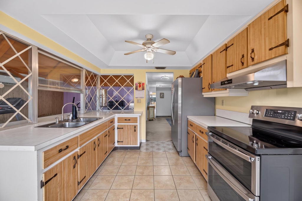 Photo of 3550 NW 33RD Terrace W, Lauderdale Lakes, FL 33309 (MLS # B26080425)