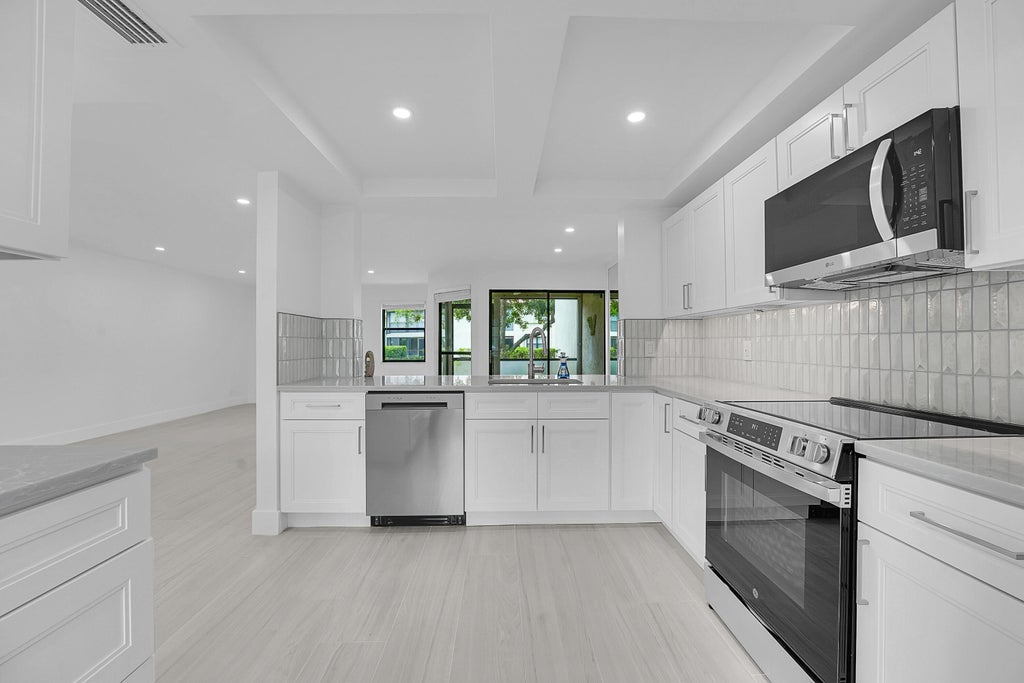 Photo of 3373 LUCERNE PARK Drive, Greenacres, FL 33467 (MLS # B26083178)