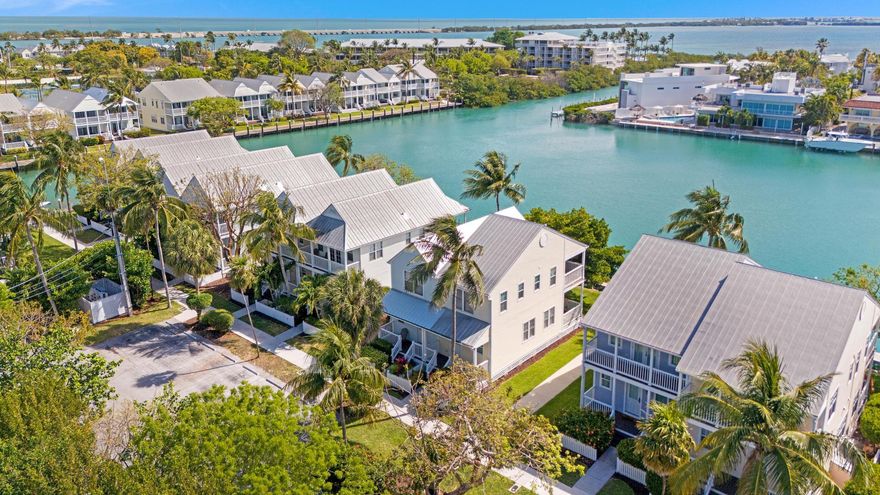 The Perfect fully furnished weekend escape, or high yield, fully managed resort style rental property! 
Experience the charm of the Florida Keys in this beautifully updated 2-bedroom, 1.5-bath villa at The Village at Hawks Cay. Set along a beautiful and wide canal, this waterfront property offers spectacular views and a peaceful setting ideal for relaxation and entertaining (and the color of the water truly is that amazing)! The interior was renovated a few years ago, featuring clean white cabinetry, stone countertops, a uniquely large remodeled bathroom upstairs and powder room downstairs. Rentable or ownable dock space is directly out back!
Enjoy the gentle sea breeze and scenic waterway views from both upper and lower balconies — perfect for quiet mornings or watching passing boats. In addition to being the perfect weekend hideaway, this property also offers the potential of a high-yield investment with rare daily rental potential!
This property currently qualifies for, and is enrolled in, the Hawks Cay Resort's rental management program. Owners have the option to join the onsite rental program, which offers a turnkey solution by managing everything from bookings to cleanings and maintenance. For those who choose to participate, the perks are exceptional  including access to more than 60 acres of resort-style amenities. Highlights include five pools, a saltwater lagoon, a full-service marina, spa, tennis courts, five dining venues, a kids' club, retail shops, and endless water adventures like fishing, snorkeling, sailing, paddleboarding, and parasailing.
A part of the prestigious Preferred Hotels and Resorts collection, Don't miss your chance to own a piece of paradise  call today to explore this exceptional opportunity!